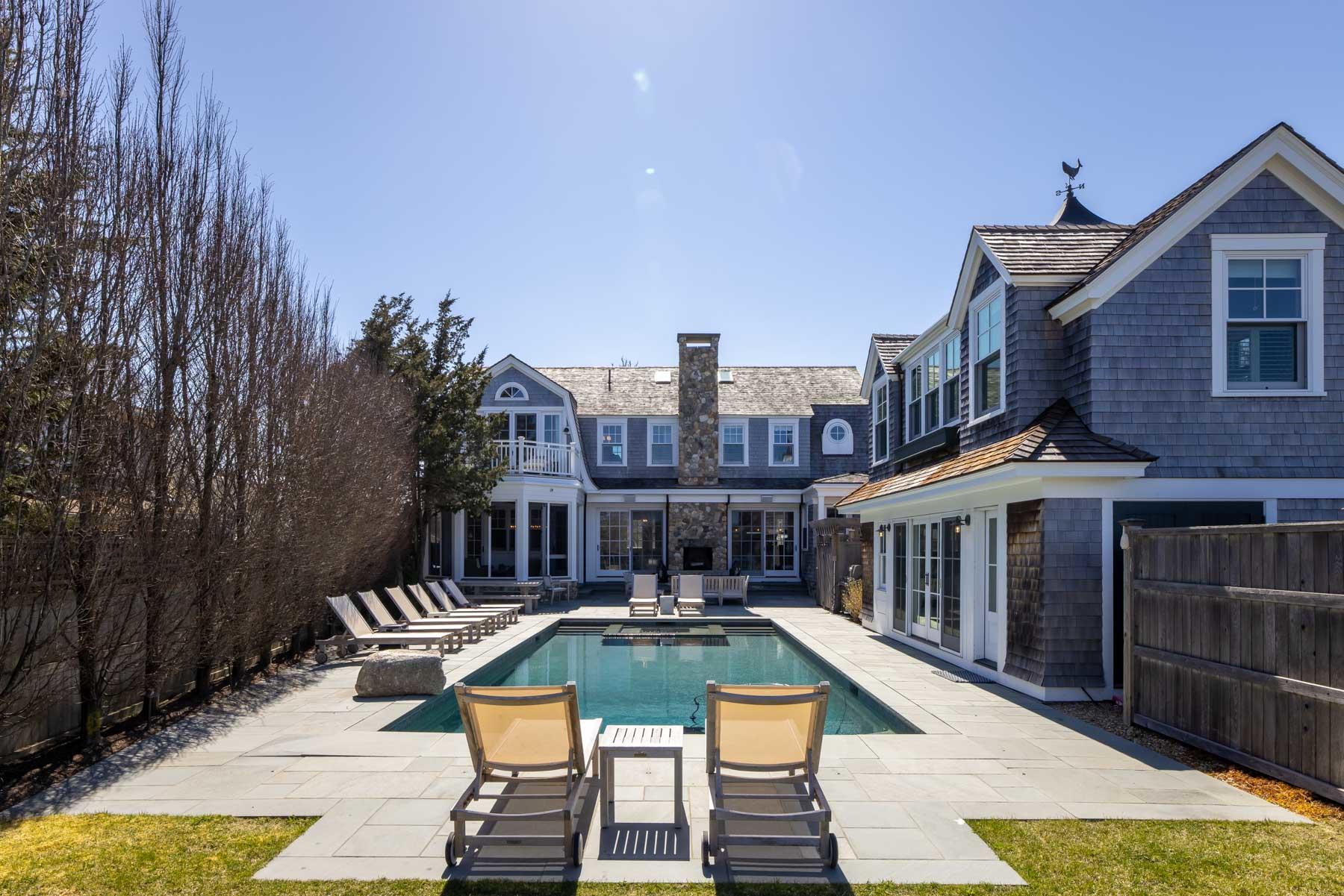 25 Pierce Lane Edgartown, MA 02539 - Photo 45 of 52 a view of a swimming pool with a lounge chairs