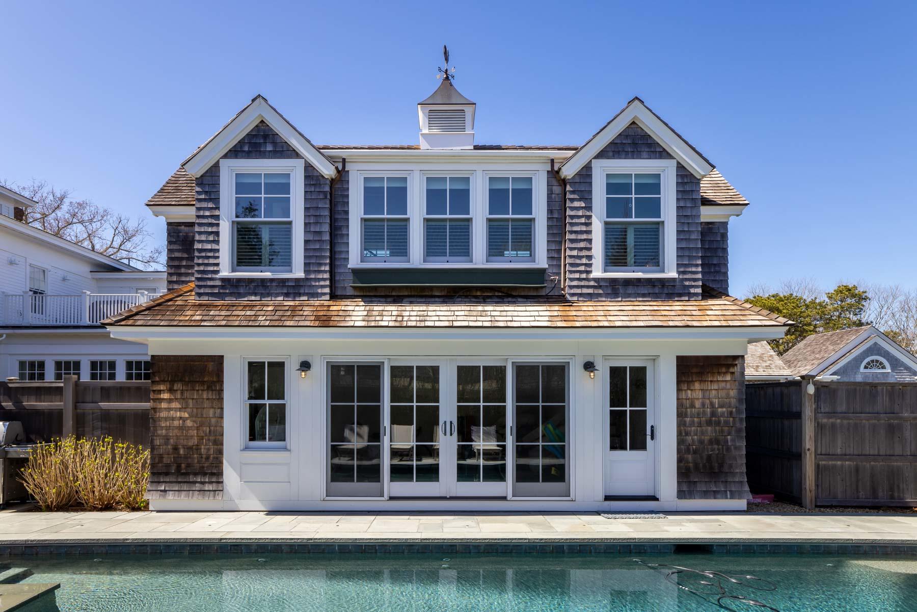 25 Pierce Lane Edgartown, MA 02539 - Photo 6 of 52 a view of a large brick building next to a yard