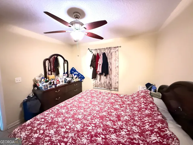 a living room with furniture and flowers