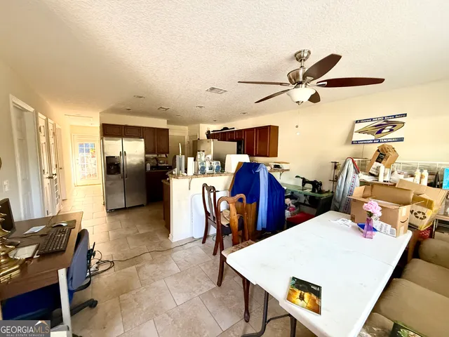 a bed room with a bed and a window