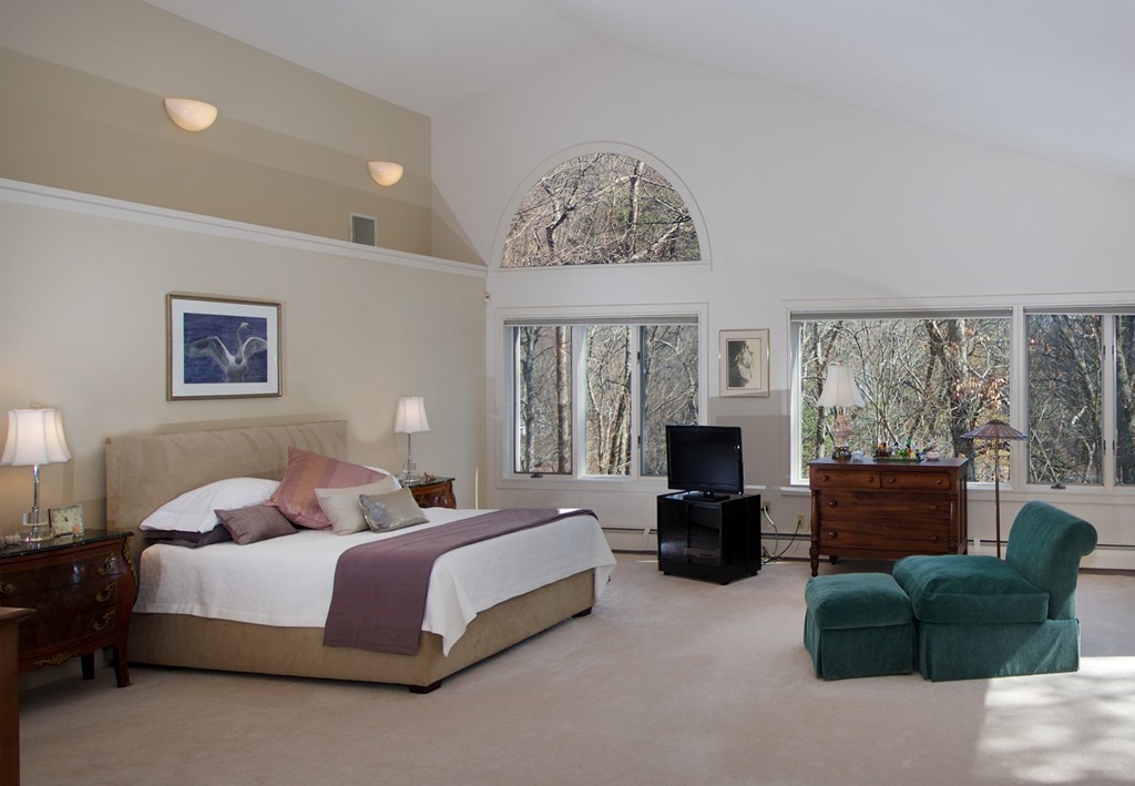 82 Sudbury Road Weston, MA 02493 - Photo 11 of 23 a bedroom with a bed couches chair and a window
