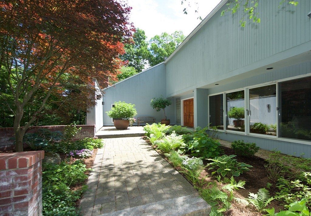 82 Sudbury Road Weston, MA 02493 - Photo 2 of 23 a front view of a house with garden