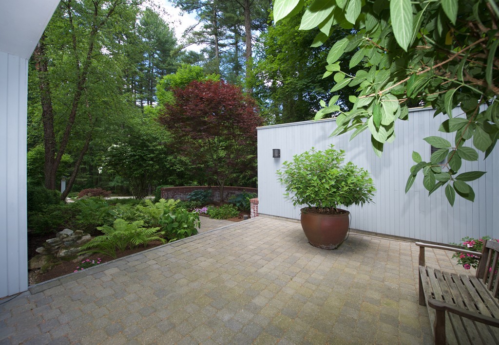 82 Sudbury Road Weston, MA 02493 - Photo 22 of 23 a view of a garden with potted plants