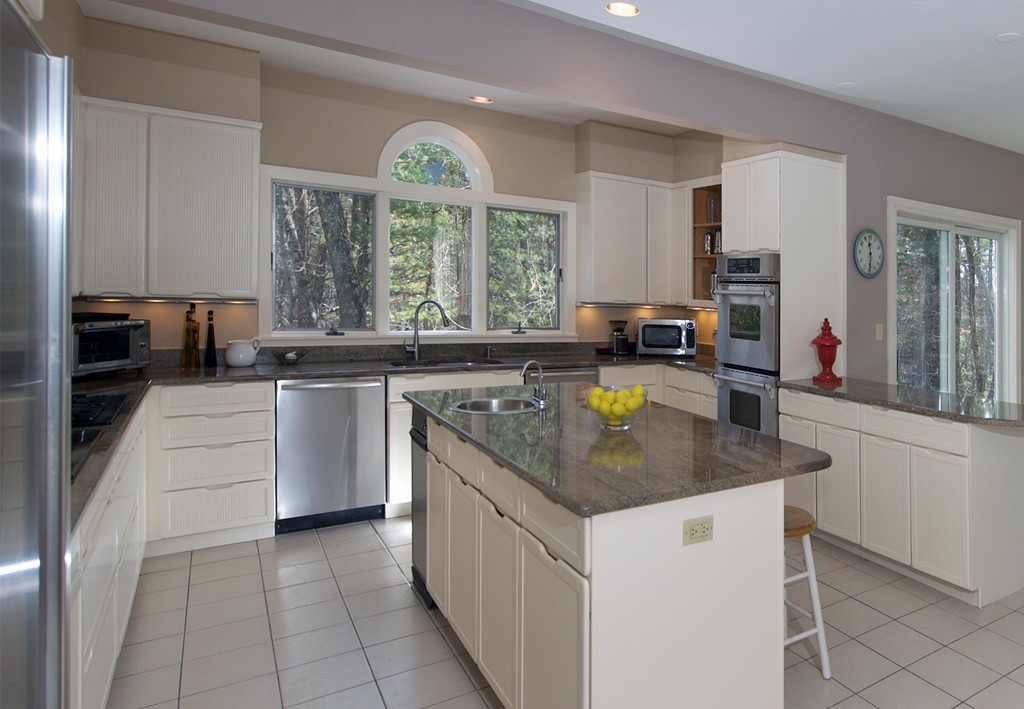 82 Sudbury Road Weston, MA 02493 - Photo 5 of 23 a kitchen with stainless steel appliances granite countertop a sink a stove a counter space and cabinets