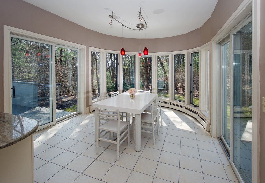 82 Sudbury Road Weston, MA 02493 - Photo 7 of 23 a dining room with furniture a chandelier and a rug
