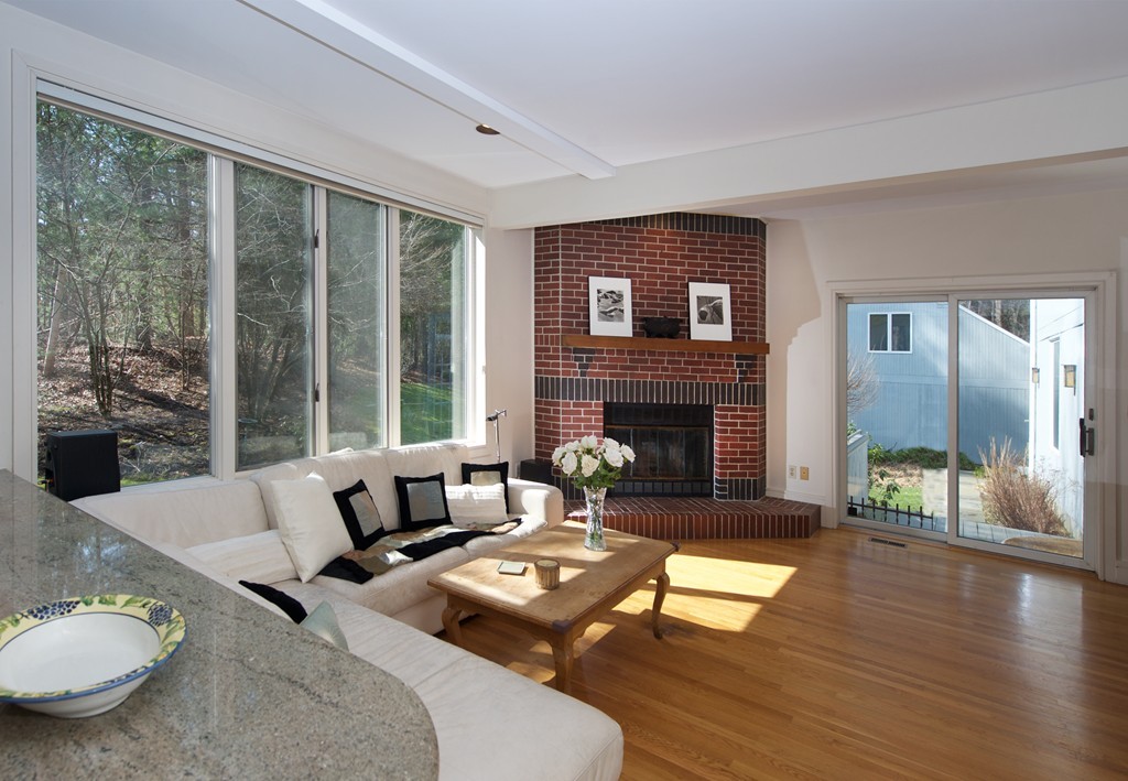 82 Sudbury Road Weston, MA 02493 - Photo 8 of 23 a living room with furniture and a fireplace