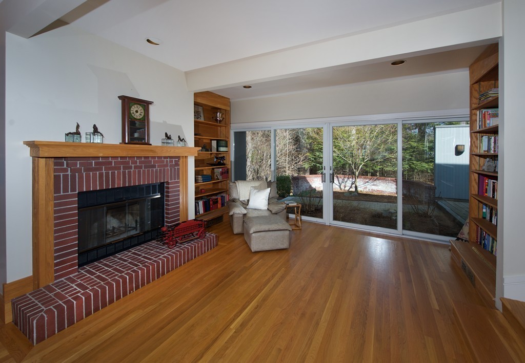 82 Sudbury Road Weston, MA 02493 - Photo 9 of 23 a living room with furniture and a fireplace