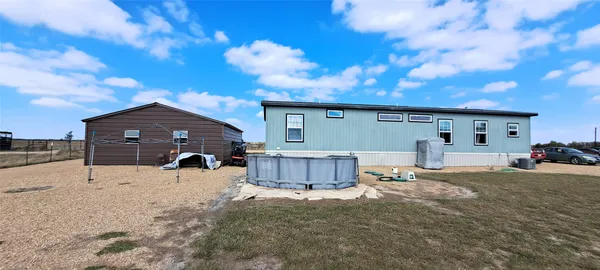 a view of a house with a snow in the yard