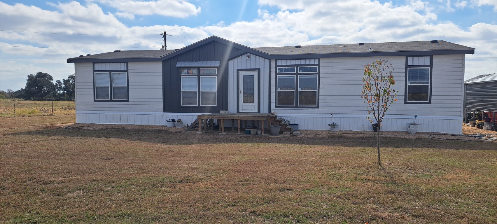 3432 County Road 206 Cameron, TX 76520 - Photo 28 of 39 a front view of a house with garden