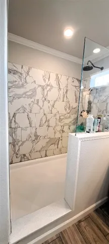 a bathroom with a sink toilet and shower