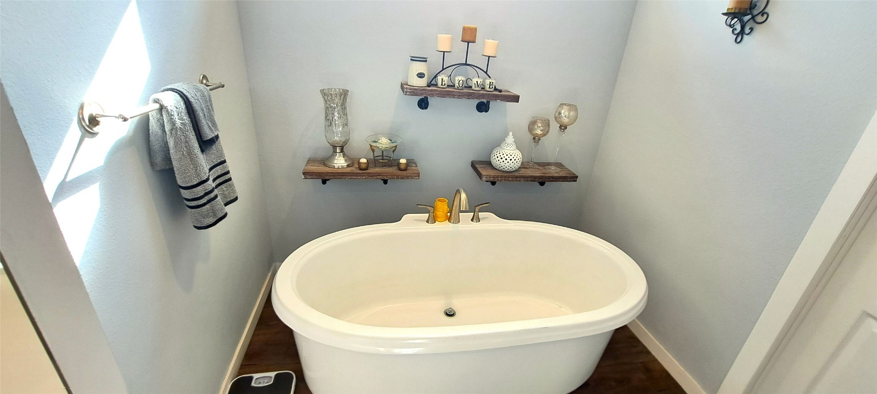 3432 County Road 206 Cameron, TX 76520 - Photo 9 of 39 a bathroom with a sink and mirror with bathtub