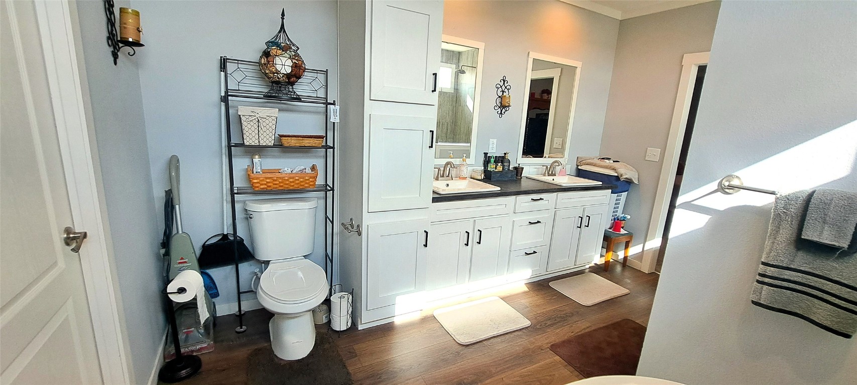 3432 County Road 206 Cameron, TX 76520 - Photo 10 of 39 a bathroom with a toilet sink and mirror