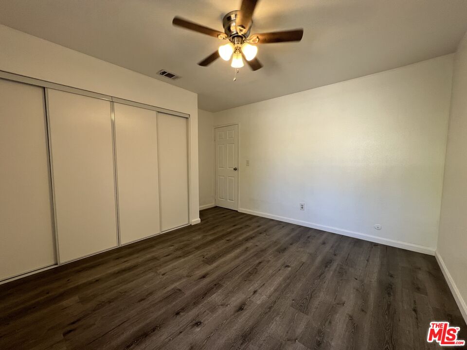 418 West Jackson Street Rialto, CA 92376 - Photo 21 of 24 a view of an empty room and wooden floor