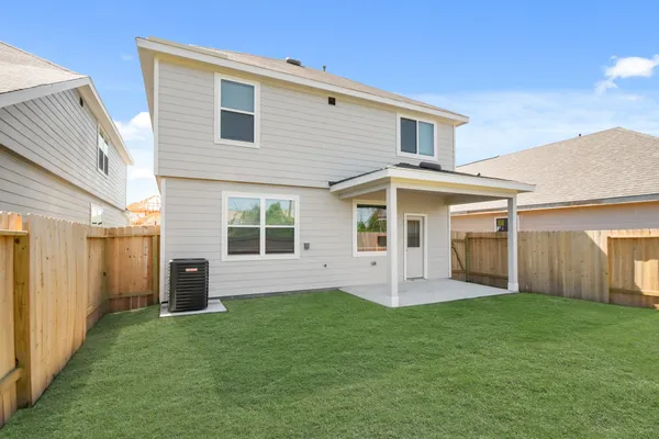 a front view of a house with a yard and porch