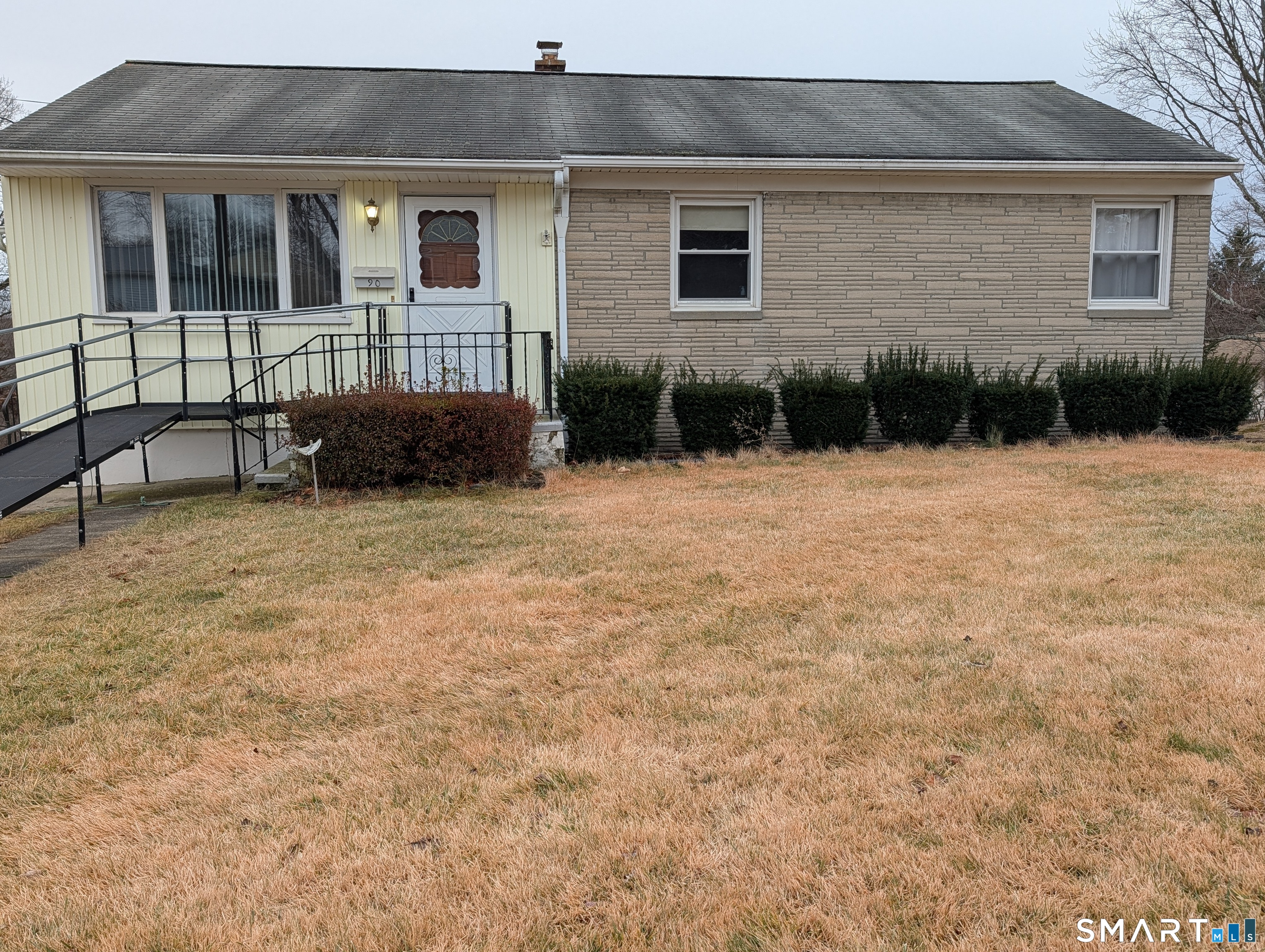 a backyard of a house with seating space