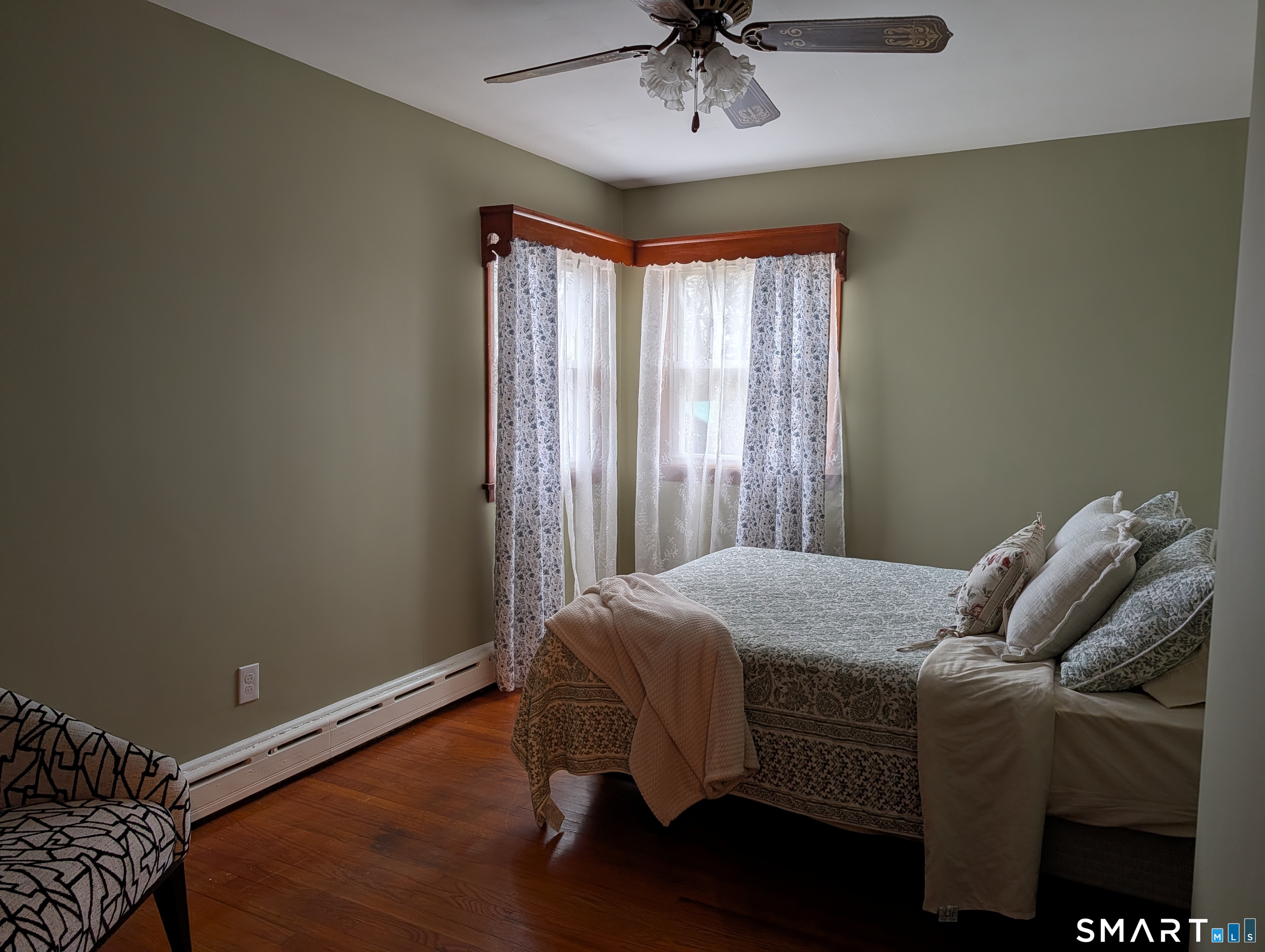 90 Hunthill Road Waterbury, CT 06705 - Photo 12 of 15 a bedroom with a bed and a chandelier