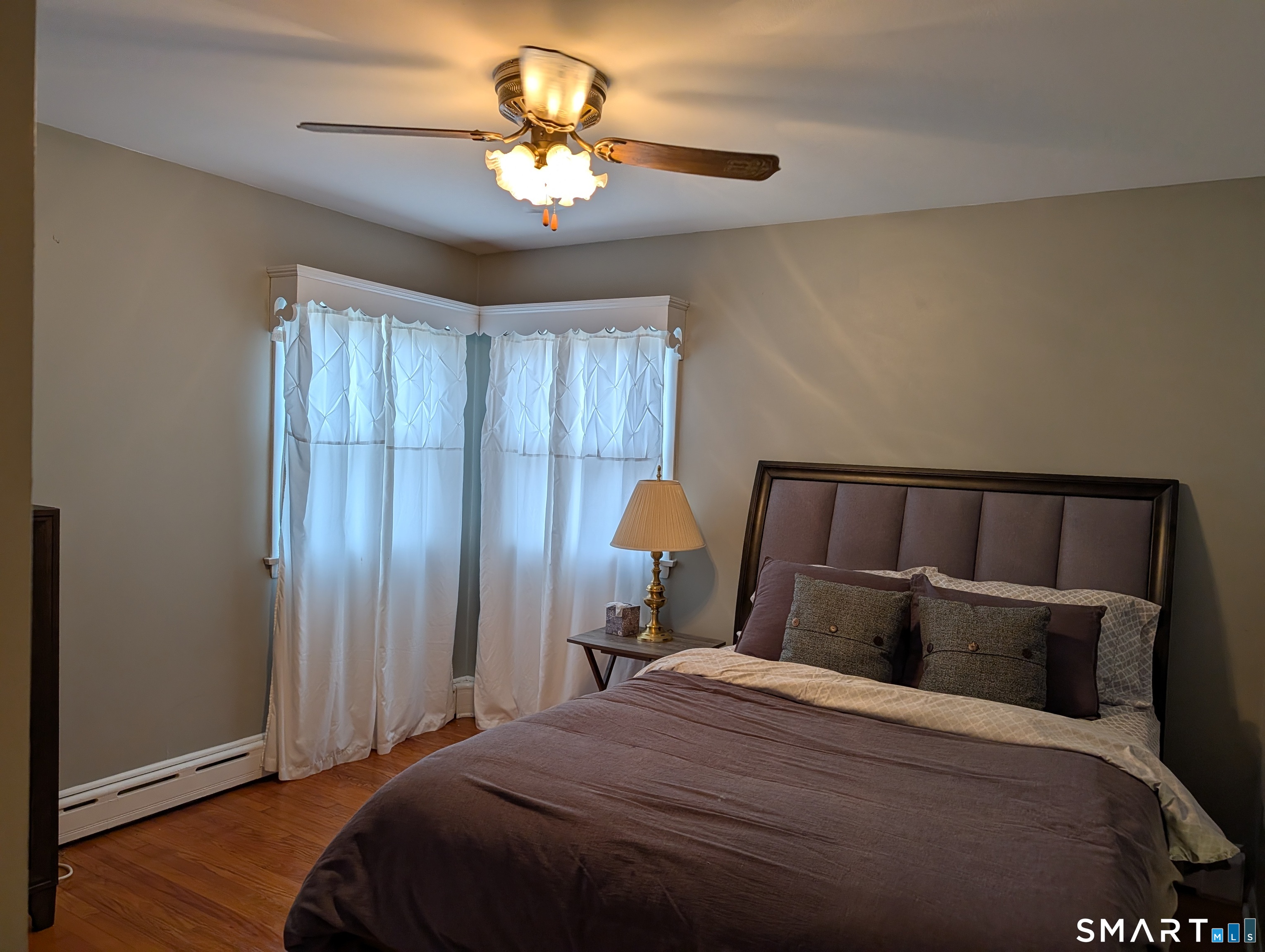 90 Hunthill Road Waterbury, CT 06705 - Photo 14 of 15 a bedroom with a bed and a chandelier