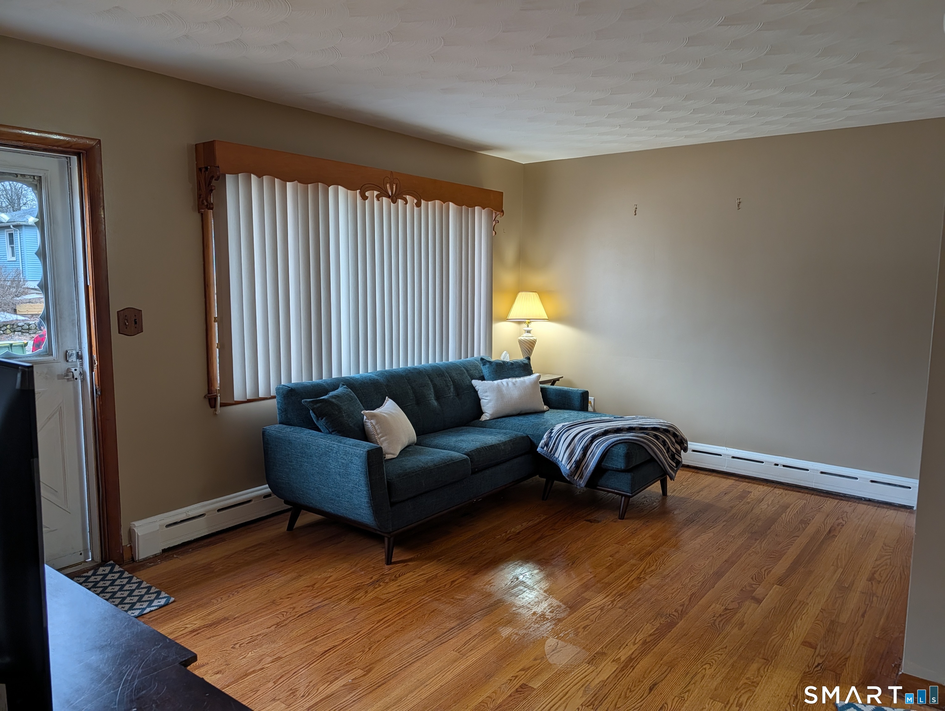 90 Hunthill Road Waterbury, CT 06705 - Photo 9 of 15 a living room with furniture and a window
