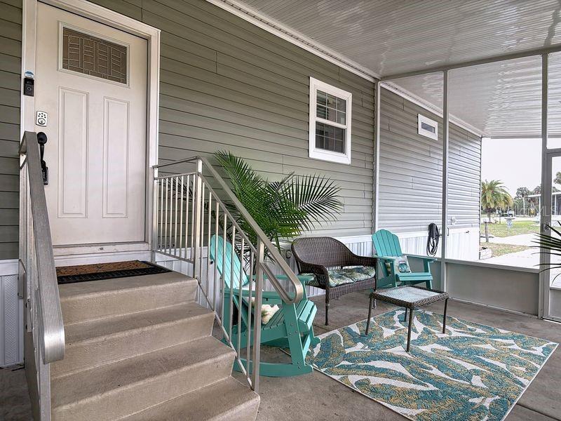 102 Ash Street Edgewater, FL 32141 - Photo 4 of 36 a view of two chairs in the balcony