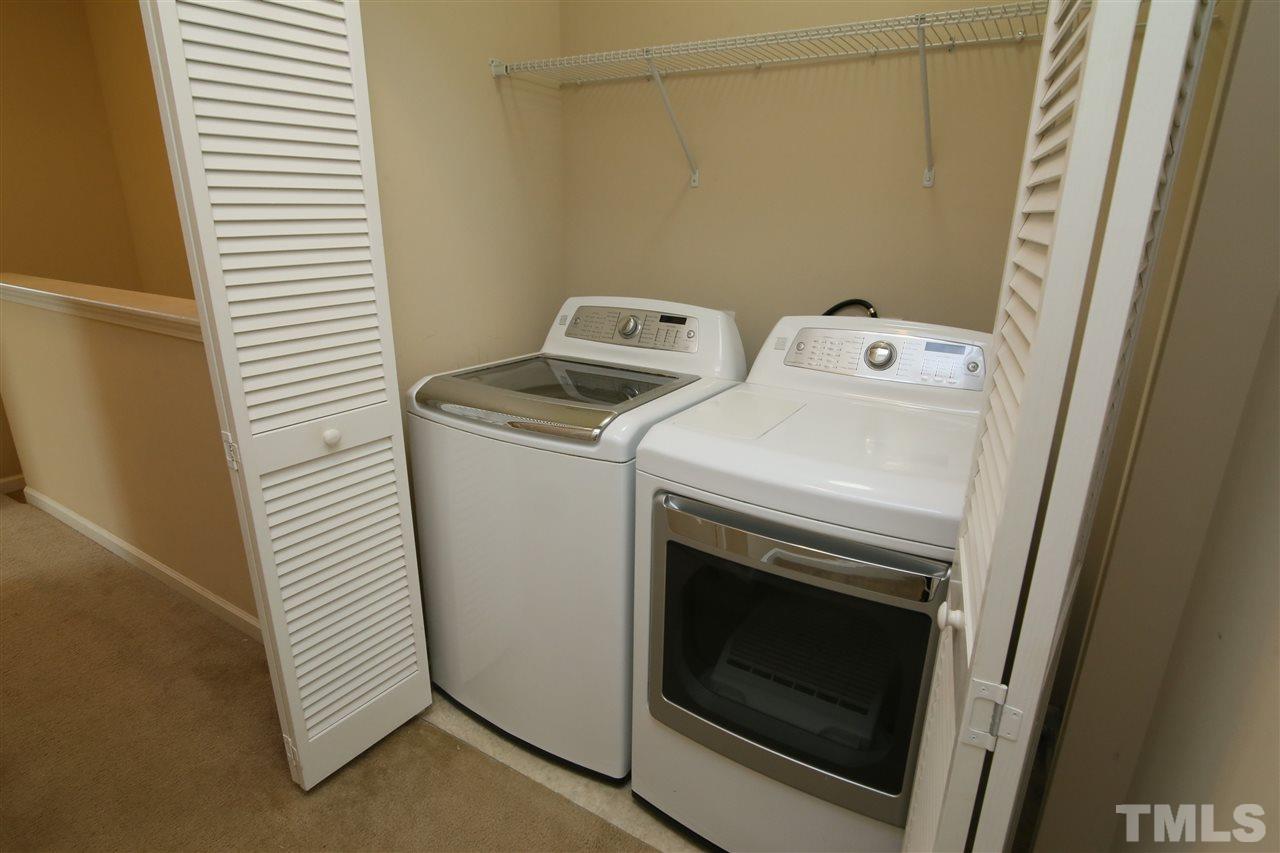 728 Wickham Ridge Road Apex, NC 27539 - Photo 13 of 21 a utility room with dryer and washer