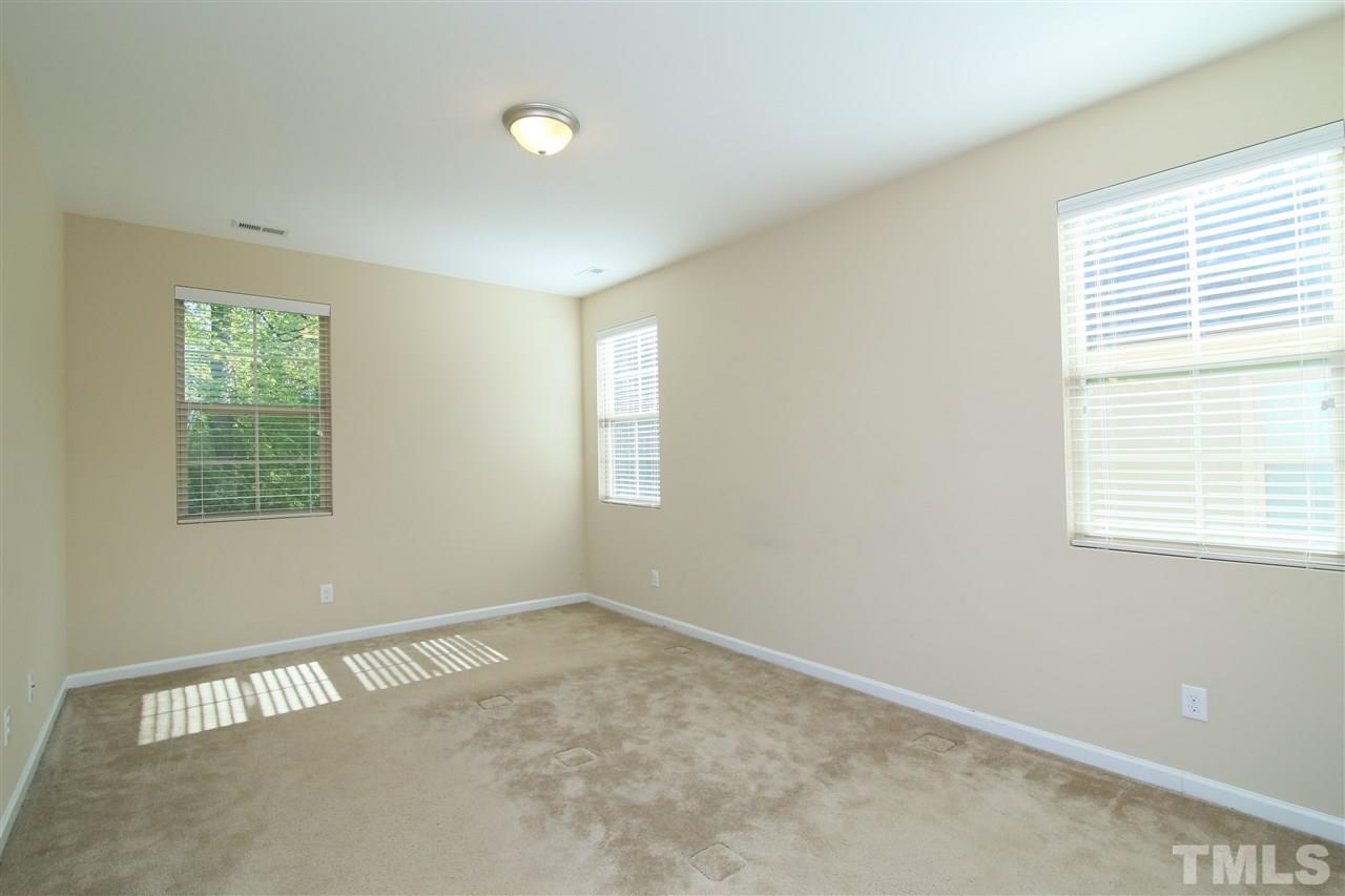 728 Wickham Ridge Road Apex, NC 27539 - Photo 14 of 21 a view of an empty room with a window