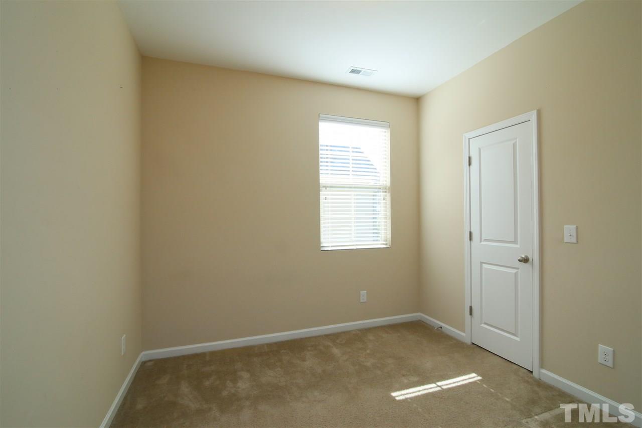 728 Wickham Ridge Road Apex, NC 27539 - Photo 16 of 21 an empty room with windows