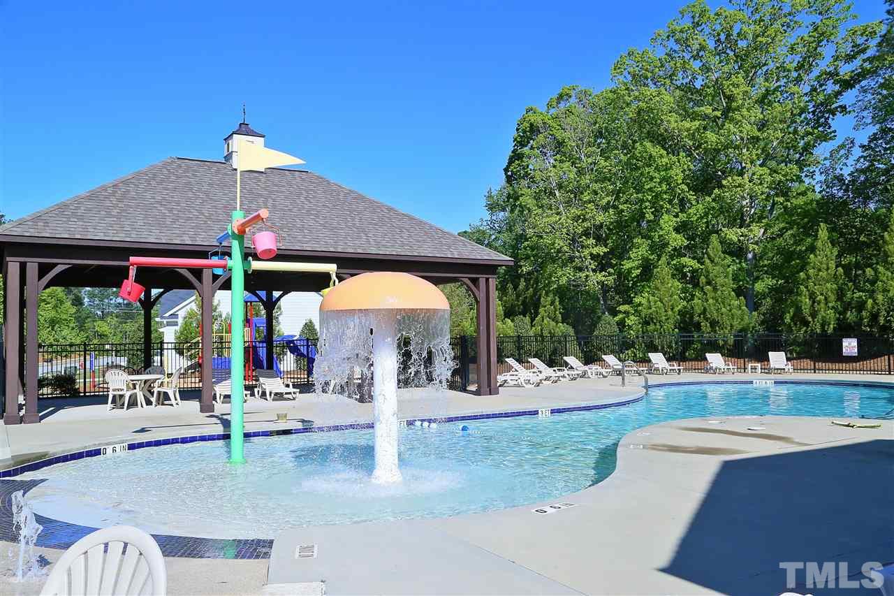 728 Wickham Ridge Road Apex, NC 27539 - Photo 19 of 21 a view of a house with a swimming pool
