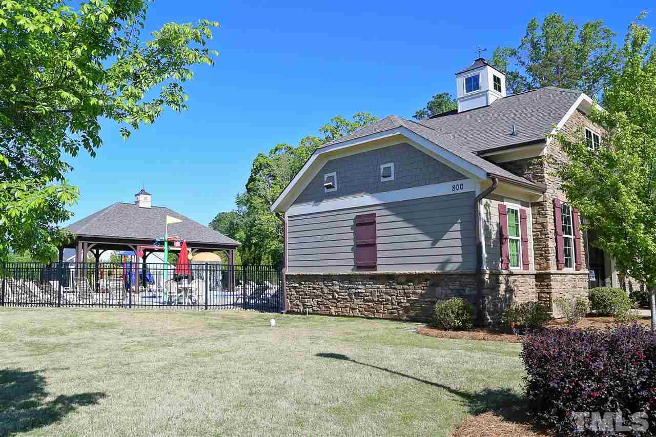 728 Wickham Ridge Road Apex, NC 27539 - Photo 20 of 21 a front view of a house with garden
