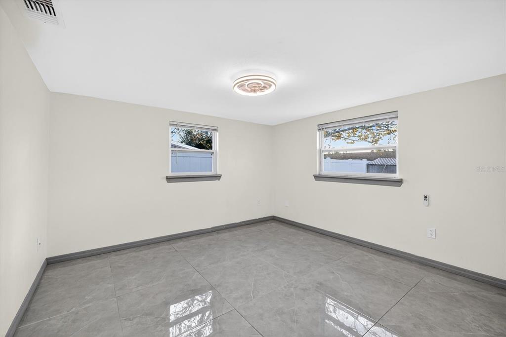 7814 Birchwood Drive Port Richey, FL 34668 - Photo 14 of 33 an empty room with a window