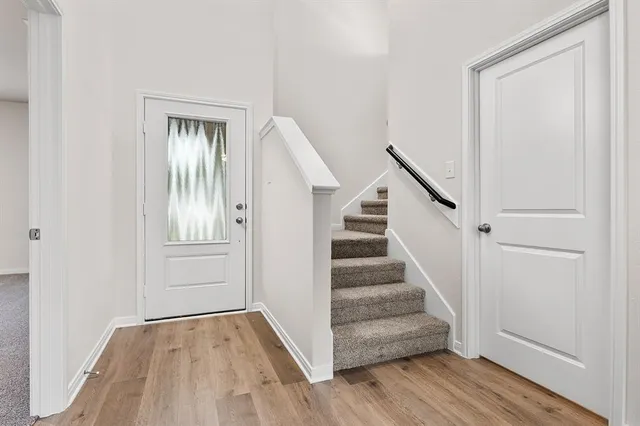 a view of entryway with wooden floor