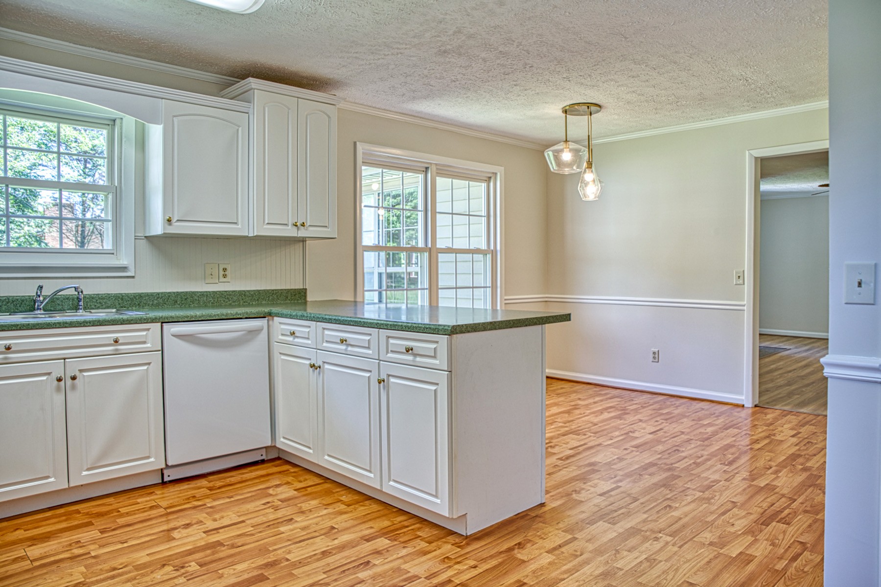 2085 Herbert Garrett Road Cookeville, TN 38506 - Photo 21 of 39 a kitchen with granite countertop white cabinets and white appliances