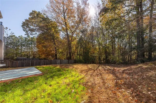a view of swimming pool with a yard