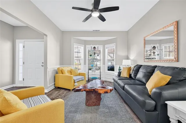 a living room with furniture and a large window