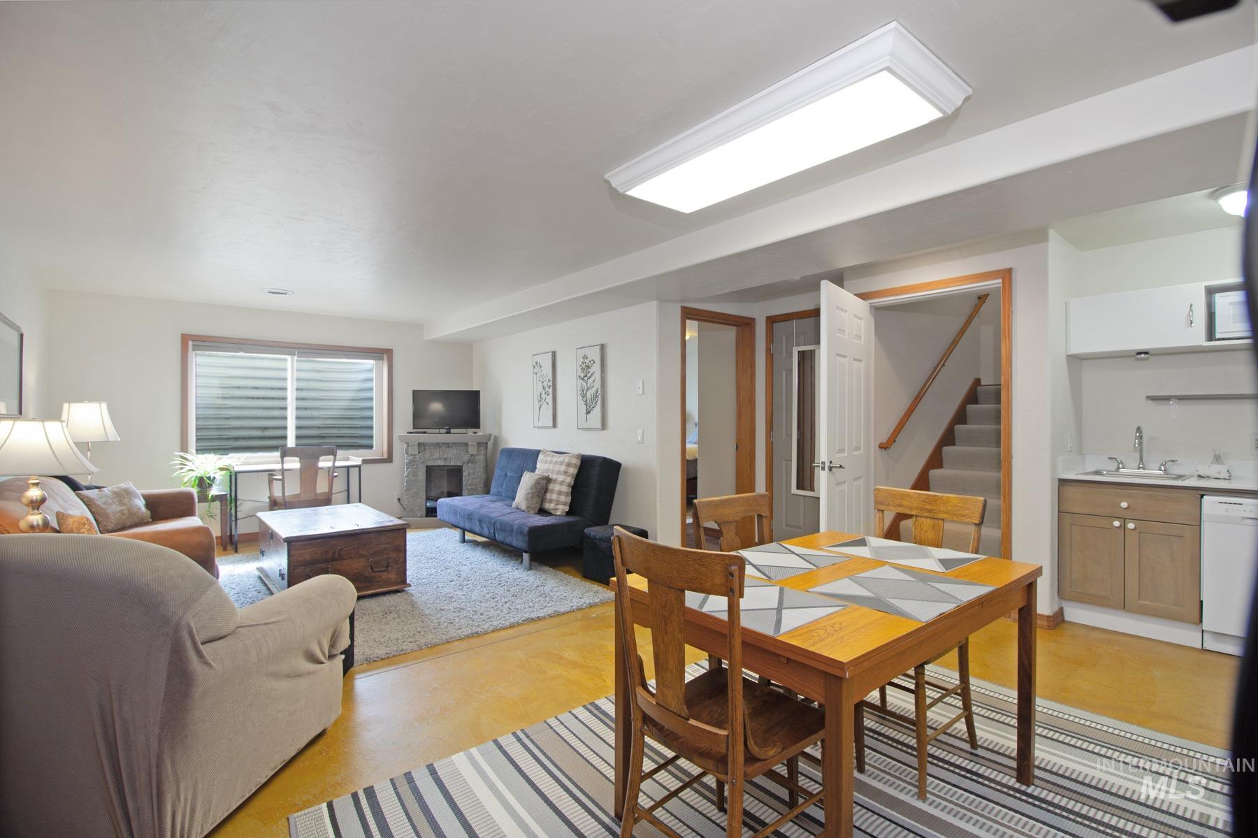 70 Tyler Drive Bellevue, ID 83313 - Photo 22 of 29 Dining space with stairs and a fireplace