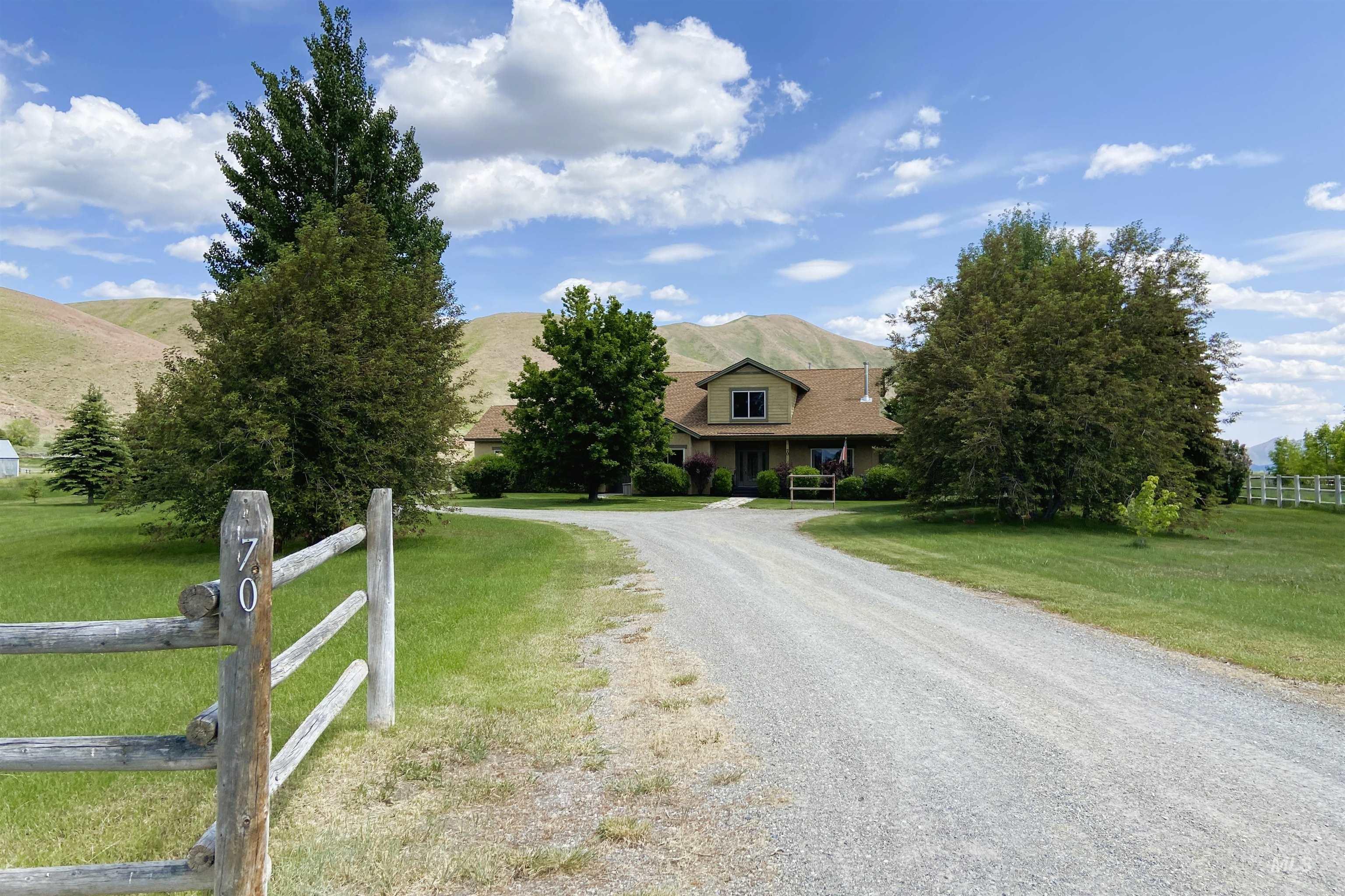 70 Tyler Drive Bellevue, ID 83313 - Photo 26 of 29 View of front of house featuring a mountain view, gravel driveway, a rural view, and a porch