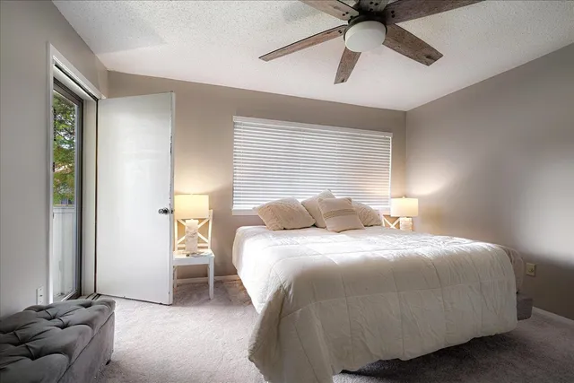 a bedroom with a bed and window