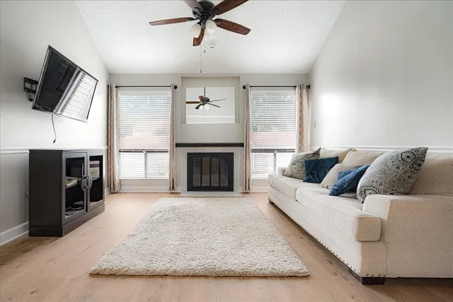 a living room with furniture and a fireplace
