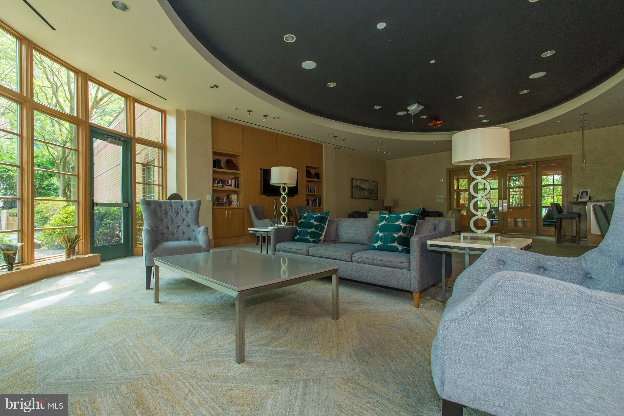 11700 Old Georgetown Road, Unit 807 North Bethesda, MD 20852 - Photo 23 of 37 a living room with furniture and a large window