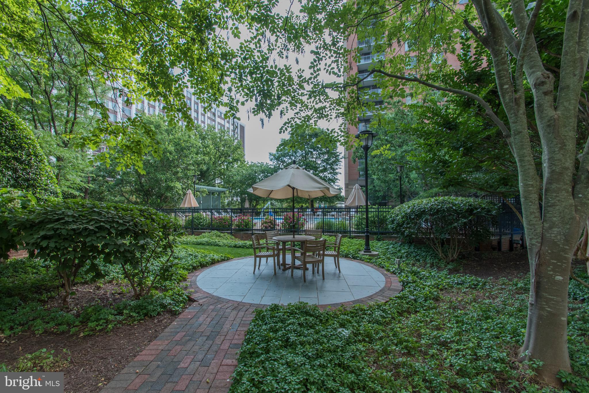 11700 Old Georgetown Road, Unit 807 North Bethesda, MD 20852 - Photo 27 of 37 a view of a chair and table in the garden