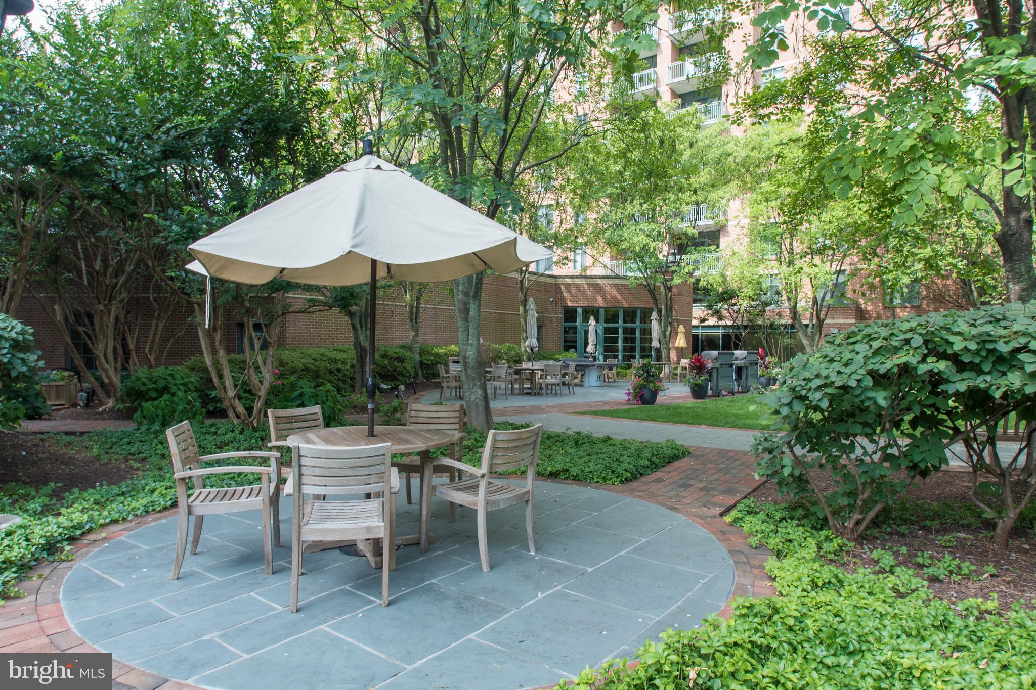 11700 Old Georgetown Road, Unit 807 North Bethesda, MD 20852 - Photo 28 of 37 a view of a house with backyard sitting area and garden