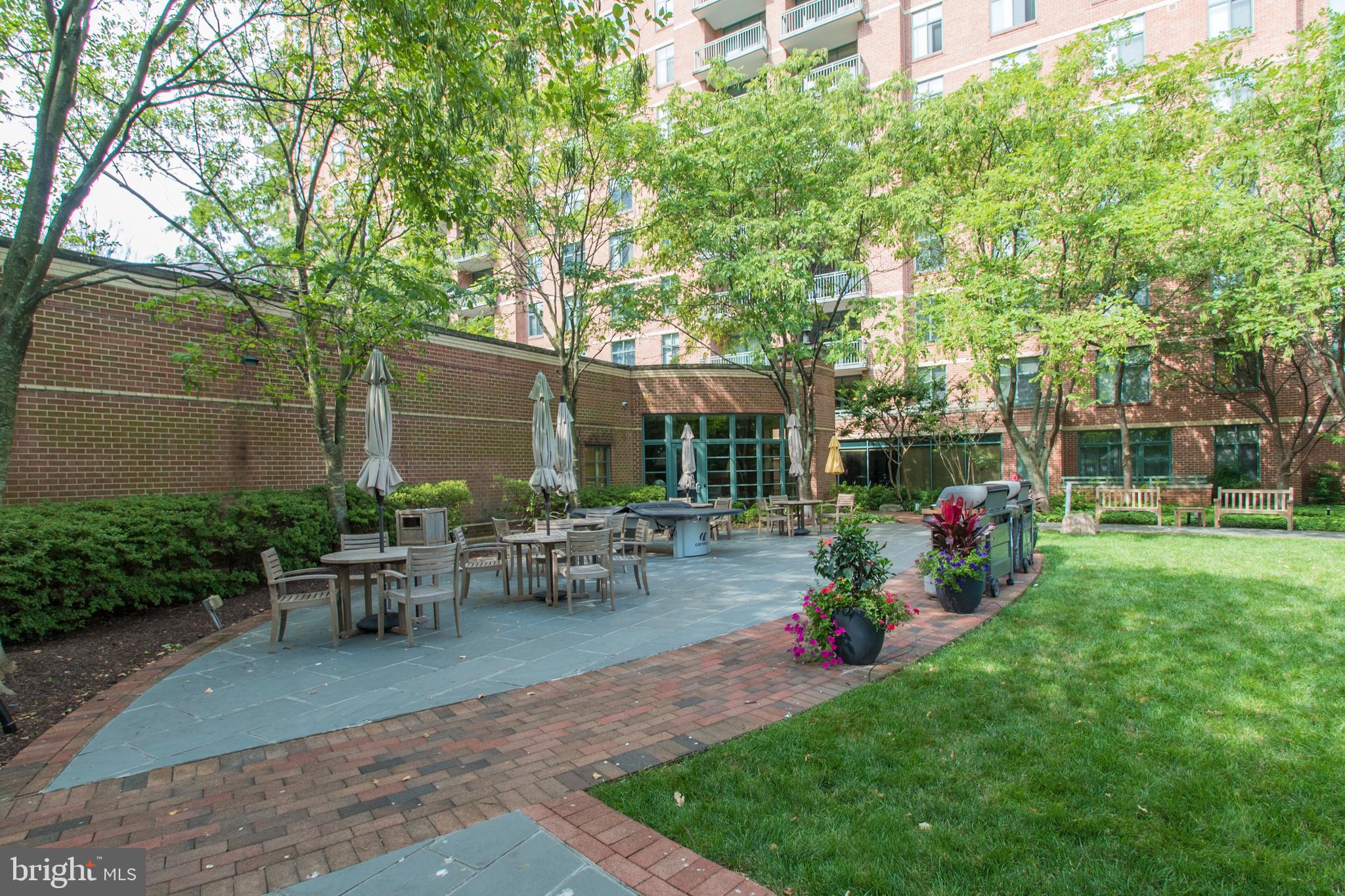11700 Old Georgetown Road, Unit 807 North Bethesda, MD 20852 - Photo 34 of 37 a view of a backyard with sitting area and garden