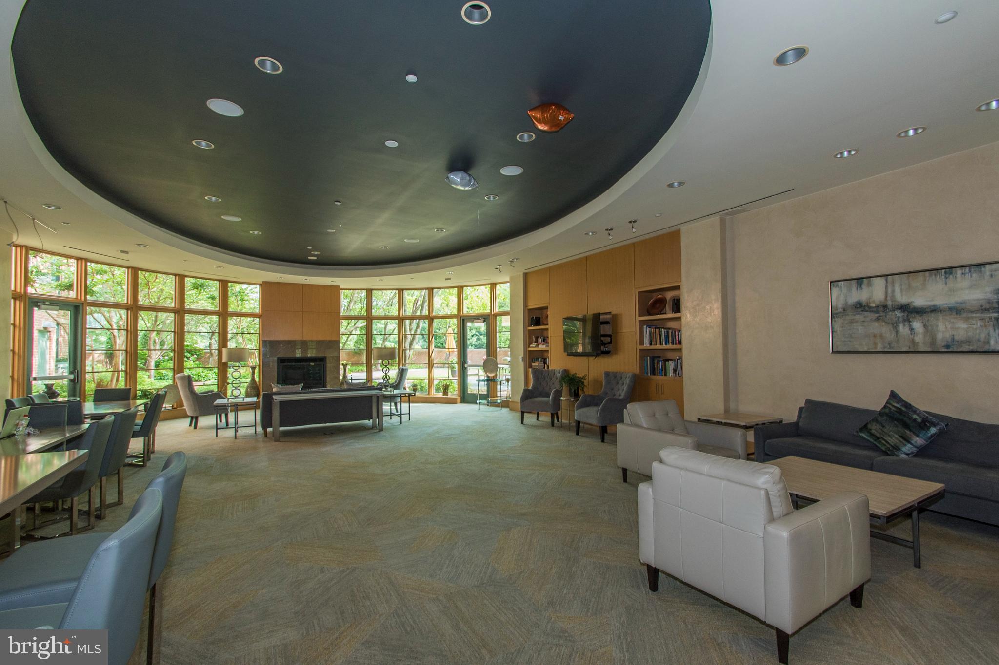 11700 Old Georgetown Road, Unit 807 North Bethesda, MD 20852 - Photo 6 of 37 a living room with furniture and a flat screen tv