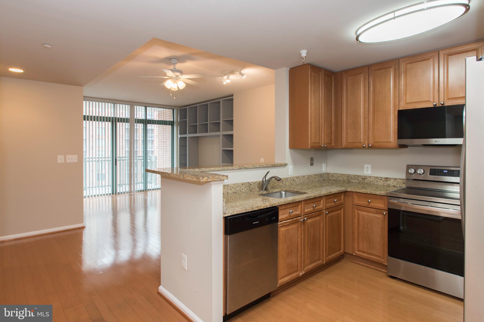 11700 Old Georgetown Road, Unit 807 North Bethesda, MD 20852 - Photo 7 of 37 a kitchen with a sink stove and cabinets