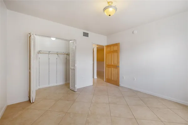 an empty room with a bathroom