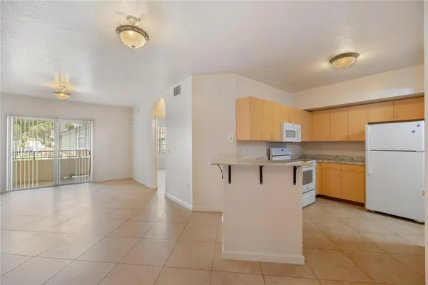 a view of a kitchen with a sink