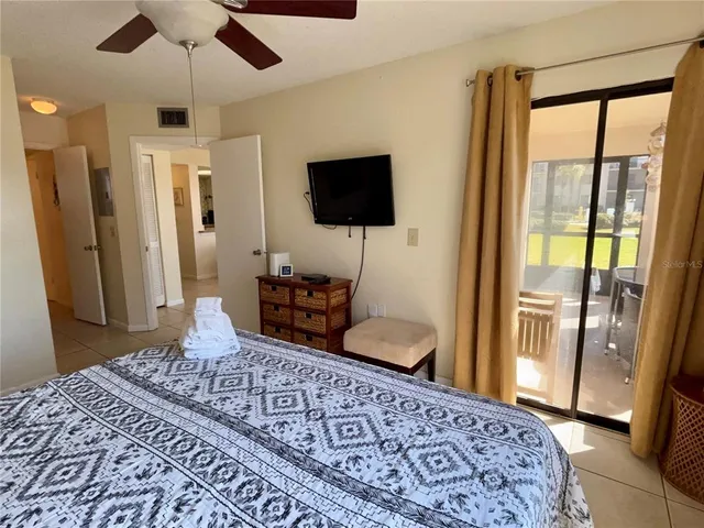 a bedroom with furniture and a rug