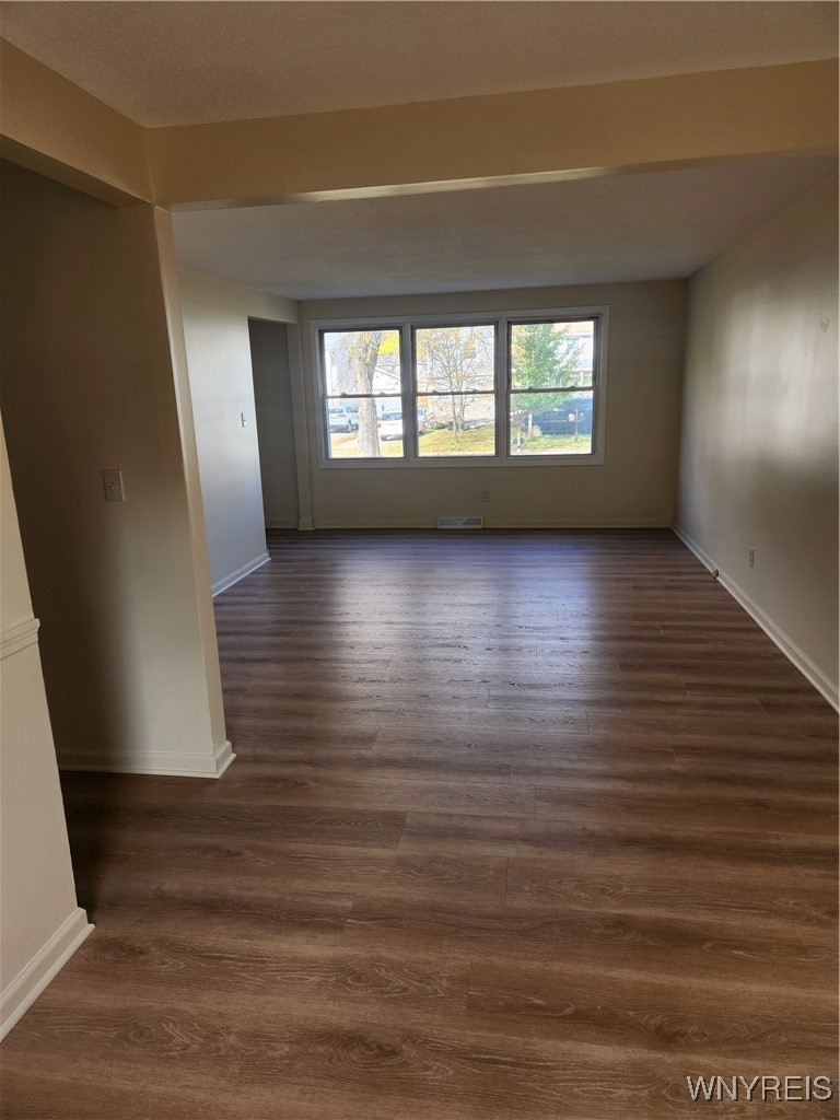 95 Pheasant Run Road Amherst, NY 14228 - Photo 8 of 22 Shows brand new flooring from dining room to livin