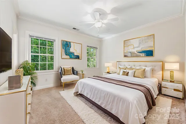 a spacious bedroom with a large bed and a large window