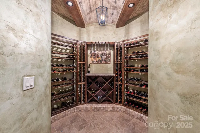 a room with pool table and windows