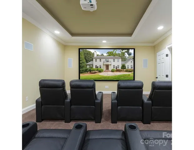 a bathroom with a granite countertop toilet sink and mirror